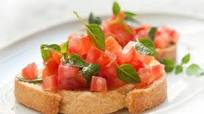Bruschetta de tomate e manjericão Bruschetta de tomate e manjericão