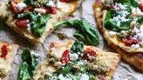 Hummus Flatbread with Sun-Dried Tomatoes, Spinach, and Pesto Hummus Flatbread with Sun-Dried Tomatoes, Spinach, and Pesto