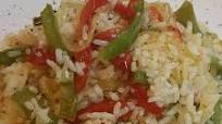 Arroz con sofrito de pimientos y cebolla Arroz con sofrito de pimientos y cebolla