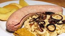Grüner Schüblig mit Chäshörnli und Öpfelstückli Grüner Schüblig mit Chäshörnli und Öpfelstückli