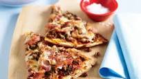 Spicy meat lovers pizza with salad Spicy meat lovers pizza with salad