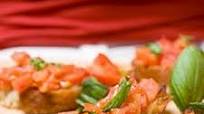 Festive warm Brie with bruschetta topping Festive warm Brie with bruschetta topping