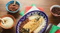 Rollo de Huitlacoche con salsa de chapulines y pepita Rollo de Huitlacoche con salsa de chapulines y pepita