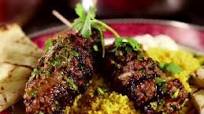 Moroccan Beef Kebabs with Curried Couscous, Raita and Charmoula Vinaigrette Moroccan Beef Kebabs with Curried Couscous, Raita and Charmoula Vinaigrette