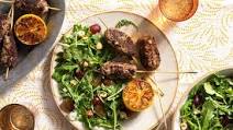Greek souzoukaklia beef skewers with arugula-grape salad Greek souzoukaklia beef skewers with arugula-grape salad