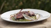 Beef with a garlic and parsley risotto and roasted shallots Beef with a garlic and parsley risotto and roasted shallots