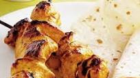 Chicken tikka kebabs with Indian salad Chicken tikka kebabs with Indian salad