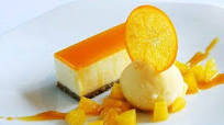 Passion fruit and white chocolate cheesecake with fresh orange sorbet Passion fruit and white chocolate cheesecake with fresh orange sorbet
