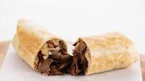 Garlic-Sesame Steak Burrito with cilantro rice and slaw Garlic-Sesame Steak Burrito with cilantro rice and slaw