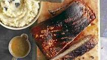 Slow-roast pork belly with black pudding mash and grain mustard sauce Slow-roast pork belly with black pudding mash and grain mustard sauce