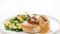 Pork Chop with Mushroom Gravy and sautéed zucchini and peas Pork Chop with Mushroom Gravy and sautéed zucchini and peas