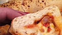 Italian Sausage, Garlic, and Red Pepper Stromboli Recipe Italian Sausage, Garlic, and Red Pepper Stromboli Recipe