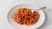 Pici all'aglione – Tuscan hand-rolled pasta with tomato and garlic sauce Pici all'aglione – Tuscan hand-rolled pasta with tomato and garlic sauce