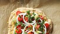 Chana Masala Hummus, cherry tomatoes, Veggies Rustic Pizza. vegan Chana Masala Hummus, cherry tomatoes, Veggies Rustic Pizza. vegan