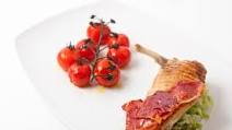 Grilled guinea fowl breast with roasted vine tomatoes and crispy ham Grilled guinea fowl breast with roasted vine tomatoes and crispy ham