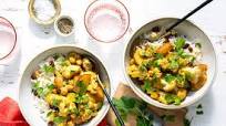 North Indian aloo gobi with potatoes and cauliflower over basmati rice North Indian aloo gobi with potatoes and cauliflower over basmati rice