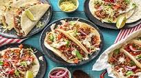 One-Pan Pork Carnitas Tacos with Lettuce, Onion, and a Lime Crema One-Pan Pork Carnitas Tacos with Lettuce, Onion, and a Lime Crema