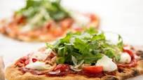 Neapolitan Pizza Margherita with arugula salad Neapolitan Pizza Margherita with arugula salad