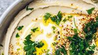 Creamy Hummus with Garlic, Toasted Sesame and Parsley Topping Creamy Hummus with Garlic, Toasted Sesame and Parsley Topping