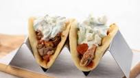 Pork Gyros with pepperoncini-cucumber crema and feta Pork Gyros with pepperoncini-cucumber crema and feta