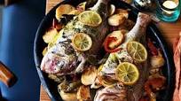 Marinated whole snapper baked on potatoes and peppers (Dorada al fondo con patatas) Marinated whole snapper baked on potatoes and peppers (Dorada al fondo con patatas)
