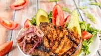 Cuban-Style Pork Chop With Avocado Salad and Citrus-Caramelized Onions Cuban-Style Pork Chop With Avocado Salad and Citrus-Caramelized Onions