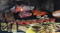 Chuletón de ternera asado a las brasas de leña de encina Chuletón de ternera asado a las brasas de leña de encina
