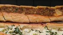 Turkish Pide with minced meat, cheese and sucuk Turkish Pide with minced meat, cheese and sucuk