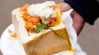 Bunny chow with bean curry and carrot salad Bunny chow with bean curry and carrot salad