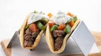 Beef Gyros and Tzatziki Sauce with green peppers and tomatoes Beef Gyros and Tzatziki Sauce with green peppers and tomatoes