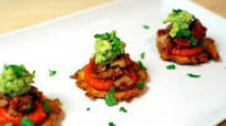 Tostone Tostada with Stewed Chicken and Parsnip Hot Sauce Tostone Tostada with Stewed Chicken and Parsnip Hot Sauce